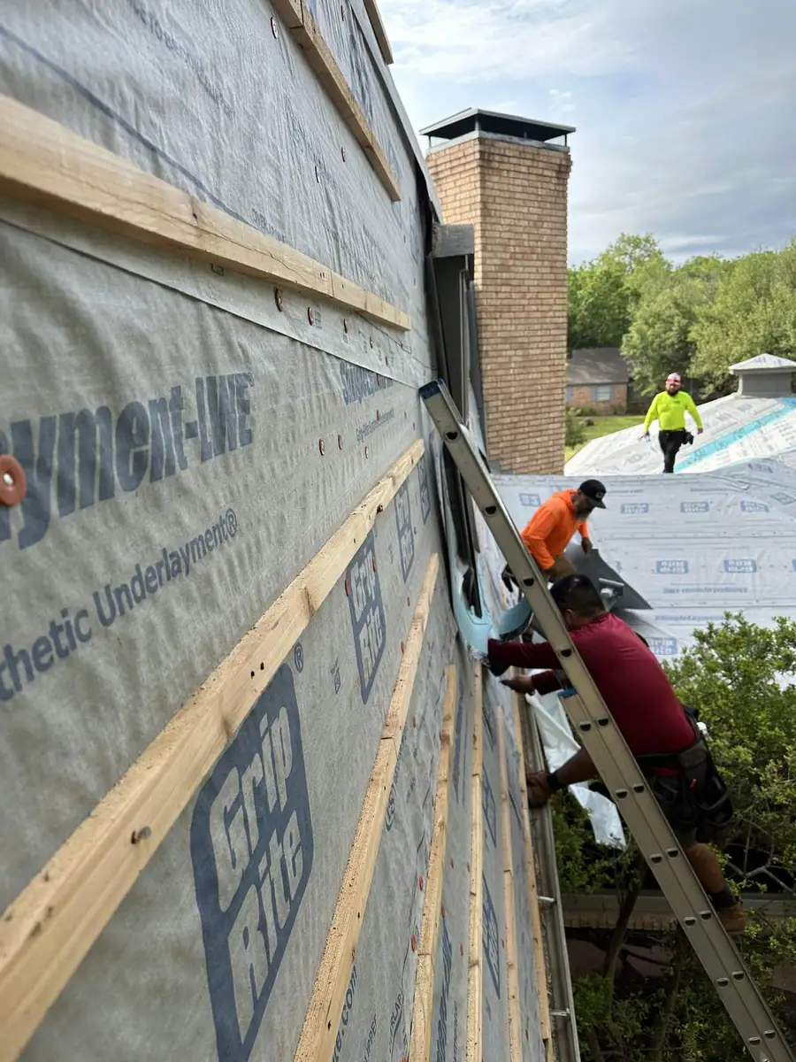 Underlayment and battens going on, course by course